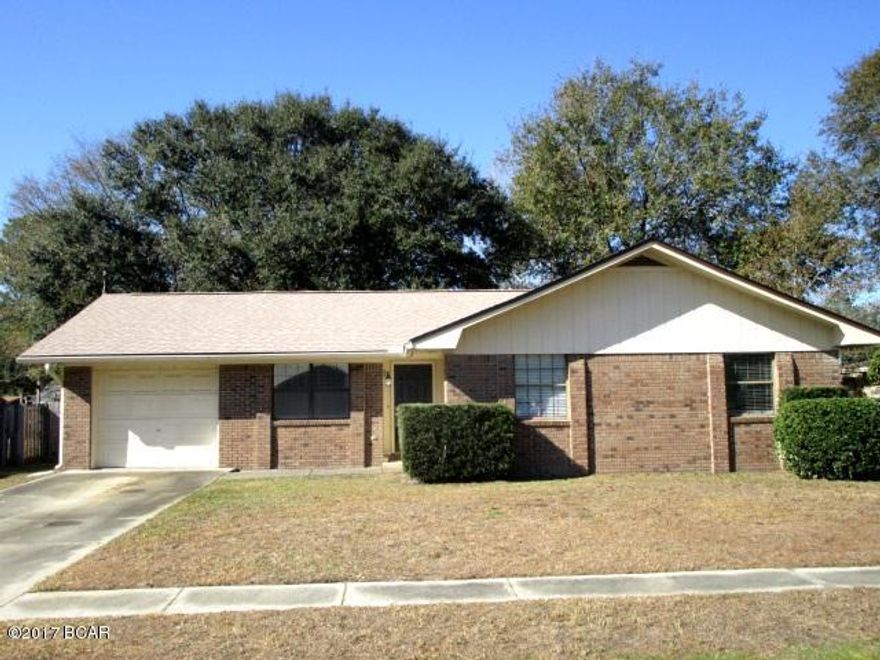 IMMACULATE HOME IN THE HEART OF LYNN HAVEN!  This all-brick home has a large Great room that is wired for surround sound and features laminate flooring, a brick fireplace, and a beautiful beamed ceiling.  The kitchen has ceramic tile floors, ample counter space with under counter lighting and is open to the eat-in dining area.  The dining area has a large glass-sliding door to the backyard that also provides great light.  The Master bedroom is spacious with a full shower/tub in the Master bath, and the two additional bedrooms are a generous size.  The laundry room has additional cabinetry for storage and is conveniently located off of the one-car garage.  The home has a new roof and a large fenced yard with a playset that can stay.  This home is a must-see in this price range!