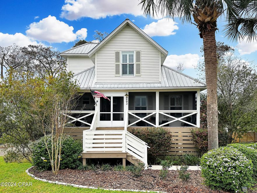 Enchanting 3-bedroom, 2.5-bathroom sanctuary nestled in a picturesque neighborhood at the heart of Port St. Joe. This meticulously remodeled residence showcases a myriad of upgrades that infuse delightful Florida charm into every corner. Immerse yourself in the expansive open concept, seamlessly combining elegance and functionality to create a space that captivates. The carefully landscaped yard presents a serene outdoor haven, featuring a spacious deck, a garden with a water feature, and a shed with electricity for versatile storage or workspace options, promising tranquility and versatility. Step inside and luxuriate in the warmth of the luxury vinyl plank flooring that gracefully spans throughout. The kitchen and bathrooms boast quartz countertops, adding a touch of opulence to the updated and remodeled spaces. Custom plantation shutters further enhance the overall aesthetic, while the screened-in porch invites you to relish the afternoon breeze, culminating in the perfect fusion of modern comfort and timeless Florida allure.
