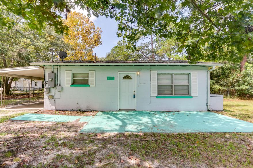 Best Priced Home in Lynn Haven!  Check out this 2 bedroom, 1 bath block home with a large yard and an open floor plan. There is plenty of space in the front yard or fenced in back yard for vehicles, RV's or boats. Great starter home or investment property.  Call your Realtor today to see this great home before its too late.