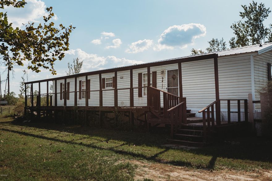 Country living with a quick commute to town life and Tyndall Air Force Base! This cozy home sits on over an acre of land with a pond in the front yard that is stocked and ready to fish! This home boasts a new metal roof, a powered storage shed in the back yard with covered parking and plenty of room for outside hobbies. Seller is motivated. Make this your home, today! **All measurements are an estimate. Buyer to verify if important.