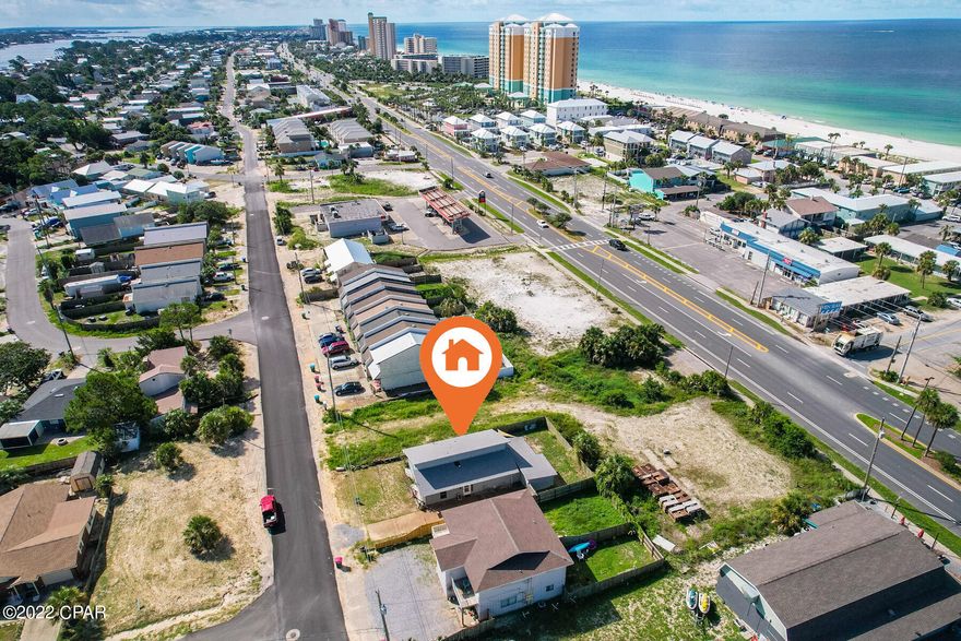 CURRENTLY UNDER CONTRACT, SELLER ACCEPTING BACK UP OFERS! Walk to the sugar white sand from this Panama City Beach home! Make it all yours or sharable to produce short term rental income! The name says it all. 8025 Beach Drive is located 1 block from beach access 16. This property is close to  local restaurants, entertainment, boating, St Andrews State Park, Pier Park, county piers and public boat ramps. It has a newer shingle roof, fence, stainless fridge, and a large shed that could possibly be converted into additional sleep space / bunk room. There are beautiful tile floors throughout most of the home. Your future beach house is ready for you. Schedule your showing today!