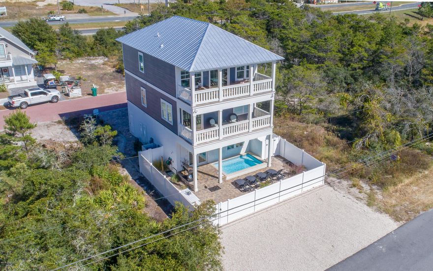 This beautifully decorated and spacious beach house, built in 2016, consists of over 3,200 square feet in this three-story cottage. There are 5 bedrooms, 6 baths, and a private 12x10 heated pool to complete your own paradise!  The first floor has an open floor plan with the living, dining and a gourmet kitchen, which is large enough for all of your family gatherings!    The second floor has the master bedroom, master bathroom and a balcony, plus there are two more guest bedrooms with their own en-suites. The third floor has a bunk room, another guest bedroom with an en-suite and a second living area with a balcony that showcases the sweeping gulf views! This home is only a five minute walk to the beach and is close to 30Avenue that has a variety of shopping and dining venues.
