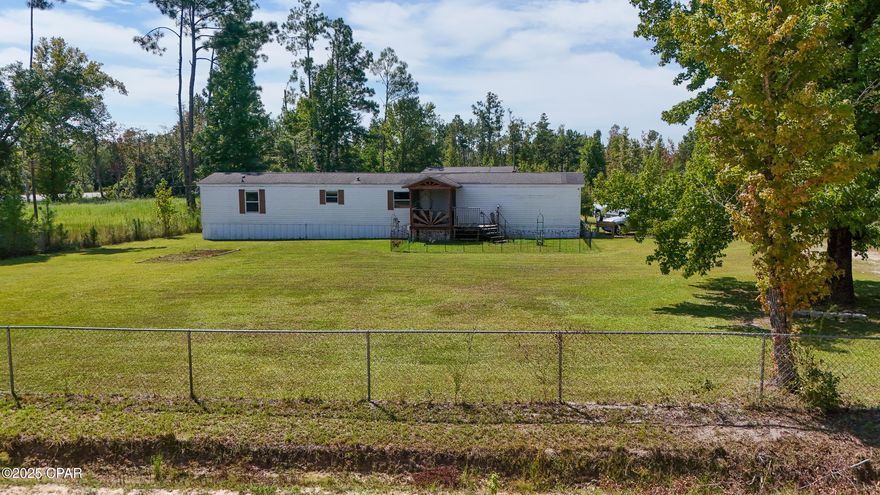 CURRENTLY UNDER CONTRACT, SELLER WILL CONSIDER BACKUP OFFERS. Enjoy peaceful country living on 2.9 acres with this 3 bedroom, 2 bath mobile home. The property offers plenty of space both indoors and out, with an open floor plan and room for family and friends. A 35' x 35' garage/workshop on a concrete slab with electricity is perfect for projects, storage, or extra parking. Outdoors, you'll love the large L-shaped pond, a chicken coop ready for your flock, and mature fruit trees and berry plants, including 2 lemon trees, blackberry vines, and a small strawberry patch. Behind the front parcel there are two additional parcels included with the sale: 00969-010-000, and 00977-000-000. Whether you're looking to garden, raise animals, or simply enjoy wide-open space, this property provides the perfect setting. With a blend of comfort and country charm, this home is ready for its new owner to make it their own.
