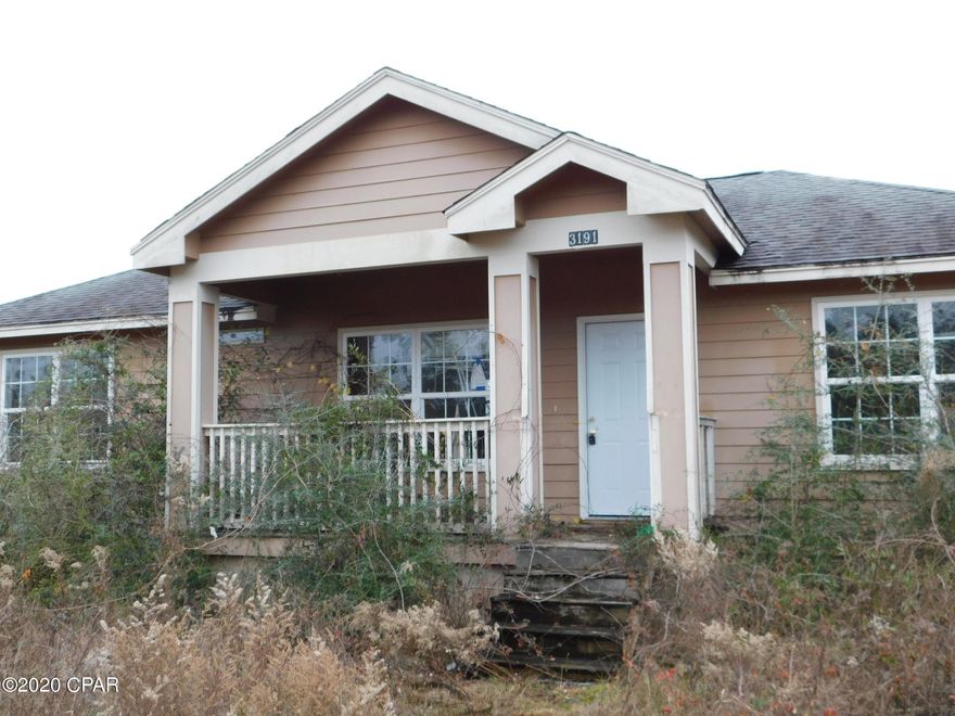 This home is situated on 1.88 Acres and has loads of potential!  The living area is off the kitchen and eat-in breakfast room,, and it features a split-bedroom floor plan.  The home has extensive damage from Hurricane Michael, but if you are looking for a future project and a future home, this is it!