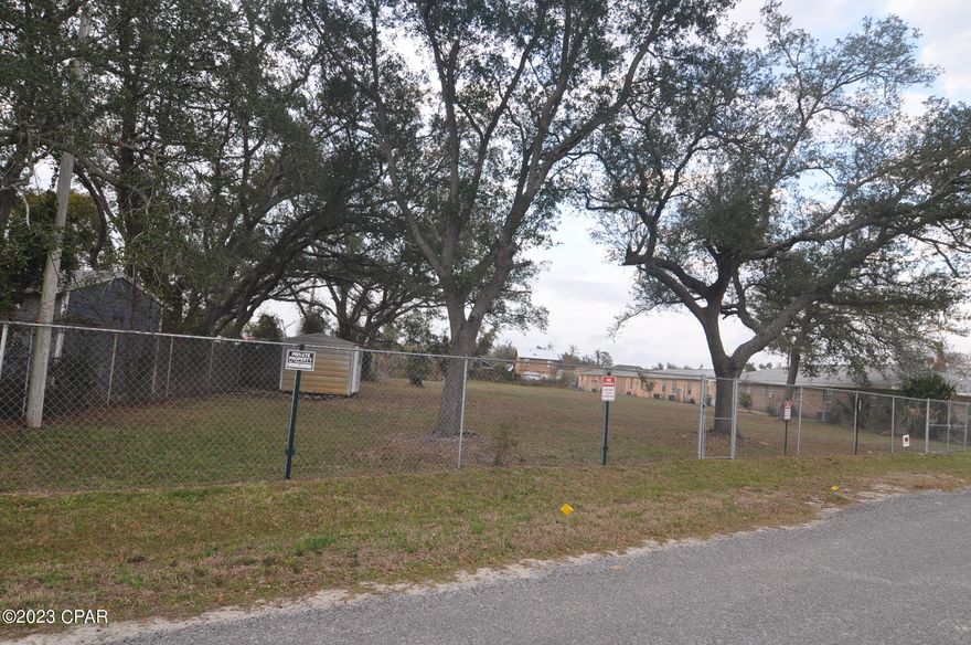 Large vacant lot conveniently located just north of 23rd street and few hundred feet off of Michigan Ave. Close to the college, shopping and Beaches. Over a half acre, 82 front feet by 300 feet deep, cleared and completely fenced with multiple options for investor or developer. Perfect for town homes, duplex or single family residences. Currently located in unincorporated Bay County, however annex it into the City of Panama City as Mixed use three, and get higher density for more units per acre. Property located in Flood Zone X by 2009 flood maps. Small shed on property conveys. Buyer to verify all information, densities allowed and potential uses.