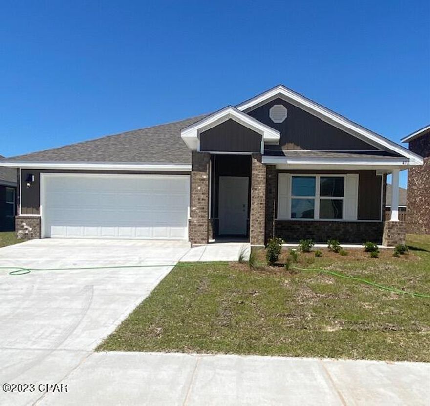 Beautiful new home only minutes to Lynn Haven, in the Titus Park community! Four bedroom, two bath home with a two car garage. Split bedroom floorplan with open kitchen and living room .Kitchen with large island and stainless steel appliances and a large pantry. The home has LVP flooring in living areas and carpet in all bedrooms. Master bath with walk in closet.
This home comes standard with a Smart Home Technology package which includes a keyless entry, Skybell doorbell, automated front porch lighting, an Echo Dot device, and touch panel which can be integrated to control your lighting. Community pool scheduled for 2023. Only 14 miles to TAFB and 15 miles to PCB.