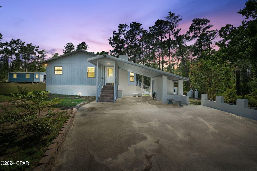 Welcome to your peaceful retreat nestled on 2.53 acres of natural beauty. The entrance is truly breathtaking, especially when the flowers are in full bloom, creating a picturesque welcome.

This quality-built 2-bedroom, 2-bathroom home features a charming sunroom complete with a built-in stone grill, perfect for year-round enjoyment. The property is enhanced by chain link fencing and elegant stucco gateways, offering both security and style.

A small outbuilding on the property, currently utilized as a workshop,
providing versatility for various uses. The home has a durable metal roof installed just 4 years ago and an HVAC system that is a little over a year old, ensuring comfort and reliability. Washer and Dryer are around a year old and convey with the sale of the property. Sellers have added new gutters on the home, and they are less than a year old!

Situated in a serene and secluded location, this beautiful home offers tons of potential. Whether you're looking for a tranquil escape or a place to create lasting memories, this property has it all!