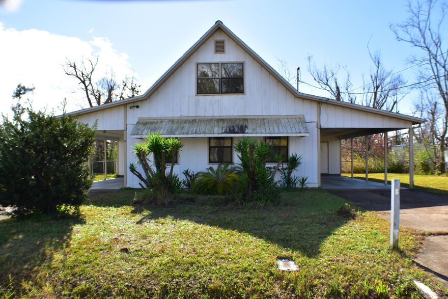 CURRENTLY UNDER CONTRACT, SELLER ACCEPTING BACKUP OFFERS.  This 3 bedroom, 2 bath home has a brand new roof! The first floor consists of a combined living and dining room, spacious kitchen, the Master bedroom and bath, and a large laundry room.  The second floor houses two additional bedrooms and the second bath. Features include some wood laminate flooring, all of the appliances convey and the ceiling fans on the second floor are new.  Parking is a snap thanks to the carports with extra storage  on both sides of the home.  Nestled on a quiet, low traffic street yet you're convenient to several schools, Tyndall AFB and Downtown Panama City!  All info is approx and must be verified by Buyers if important.