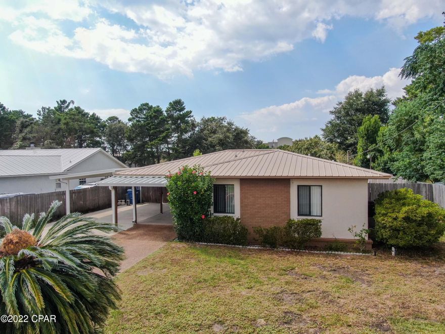 2 BEDROOM CONCRETE BLOCK HOME IN POPULAR AND SUPER CONVENIENT CENTRAL LOCATION! Home has been meticulously maintained and features a metal roof, newer appliances and whole house water softener. The 16' x 24' bonus room could be converted to 3rd and 4th bedrooms. The large backyard is privacy fenced with room for a pool. Tons of parking here with an oversized carport and driveway. Backyard also features an insulated shed with electric, a/c and fans for storage, your man cave, she shed, or maybe a personal gym. Gulf Highlands is Golf Cart Friendly with no HOA and is within 1/2 mile to Frank Brown Park, within 1 mile of Pier Park, the beach and the new beach hospital under construction. Make an appointment today and come see the possibilities with this great home!