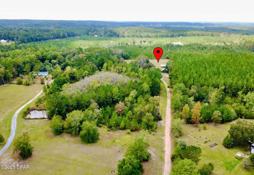 Price Improvement! This land is already set up and ready for living, making it ideal for anyone wanting to bring an RV, set up temporary living, or start building their dream home. Discover the perfect blend of country living and modern convenience on this 5.5-acre parcel. The land is mostly cleared, with approximately 4 acres fenced, and offers power, water, and sewer already in place - ready for your homestead, hobby farm, or weekend retreat.
Tiny home does NOT convey
The property features three pole barns - two enclosed with power and water ideal for workshops or storage, and one open for equipment or livestock, plus an additional storage shed with utilities.

Enjoy two RV hookups with a deck, a whole-property generator hookup, and both a private well (new pump 2024) and septic system already installed. A pole-mounted security light adds extra peace of mind. A tiny home is currently located on-site and is available for purchase separately if the buyer wants to include it. 

Accessed by a long private driveway, the property opens up to a peaceful, semi-wooded setting - offering the perfect balance of open land and natural privacy. Perfect for homesteaders, investors, or anyone seeking flexible space. Property is being sold as is with right to inspect. 

Come see for yourself the serenity and possibilities this unique property offers!

 Zoned AG - A rare opportunity to own improved acreage with infrastructure already in place - perfect for RVers, homesteaders, or anyone seeking a peaceful retreat with endless potential. Call for more information or to schedule a private showing, contact your agent or reach out to the listing agent for details. Please see Agent remarks