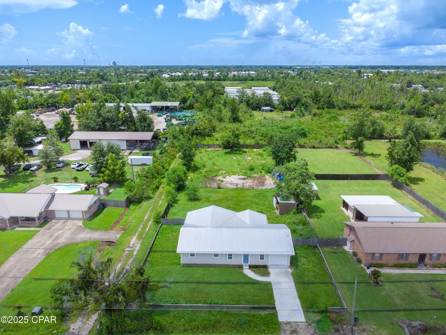 ''SHORT SALE''
Spacious 5-Bedroom, 3-Bath Home on Over Half Acre!

Welcome to this beautifully constructed home offering exceptional quality and modern design on over half acre in a desirable location! Featuring 5 bedrooms and 3 full bathrooms, this property combines space, style, and versatility.

Built to last, the home boasts a metal roof, Hardie board siding, gutters, and a one-car garage. The HUGE fully fenced backyard offers total privacy and includes both a side gate and a double gate—perfect for easily parking your boat, RV, work trailer, or toys.

Situated on R2 zoning, this property offers endless potential—add a workshop, barn, or even a guest house right in your backyard. Love the water? You're just 5 minutes from the John B. Gore Park boat ramp.

Inside, you'll find LVP flooring throughout, LED recessed lighting, and a thoughtfully designed split floor plan with TWO spacious suites. One suite is located with two additional bedrooms on one side of the home, while the second private suite and 5th bedroom are tucked away on the opposite end—ideal for multi-generational living or guests. Every closet is finished with custom wood shelving, adding both function and character.

The large laundry room features charming barn doors, cabinet storage, and a butcher block countertop. The heart of the home, the kitchen, is a showstopper with shaker-style cabinets with crown molding, quartz countertops and tile backsplash, stainless steel appliances, Industrial-style faucet and a unique pendant lighting over the island.

All information is deemed reliable but not guaranteed. Buyers should verify if important.