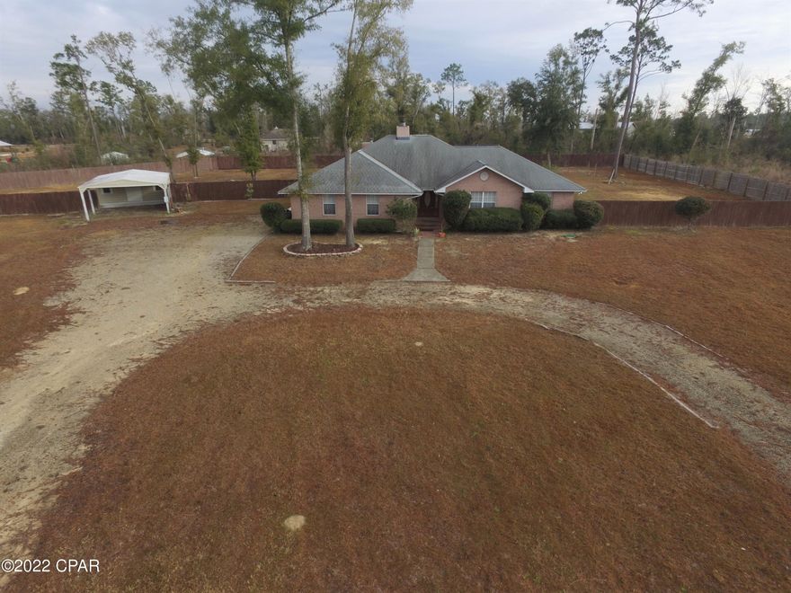 CURRENTLY UNDER CONTRACT, SELLER ACCEPTING BACKUP OFFERS.  This home in one of the most popular neighborhoods in Marianna. On a quiet cul-de-sac sitting on 3.5 acre +/- with a open floor plan to dining and kitchen area with vaulted ceilings and a wood burning fireplace. kitchen has granite counter tops an island and tons of storage.  Master bedroom is huge and has a wood burning fireplace with french doors leading out to the pool area. Master bath has double sink/vanity, separate shower and jacuzzi tub. spare bedrooms are spacious.  In-ground pool area is completely screened.  SELLER WILL GIVE ALLOWANCE FOR PAINTING AND THE FEW COSMETIC THINGS THAT NEED REPAIRING.