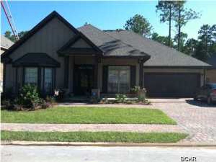 Beautiful home less than 3 years old with numerous upgrades. State of the art in-ground gunite pool with hot tub built by Cox Pools. Great outdoor space with large covered patio and outdoor TV. McKenzie floor plan with spacious kitchen/breakfast area/living combined in addition to formal dining & living spaces. Hardwood floors throughout except in baths & bedrooms. Security system with remote accessing/enabling feature with smart phone. Tankless gas hot water heater & 5 burner gas stove w/interchangeable grill/griddle grate. Upgraded stainless steel appliances & granite countertops. Mussett Bayou is a 24 lot gated community close to shops, restaurants, and short drive to the beach. This is a MUST SEE! Seller is a licensed Florida real estate associate.