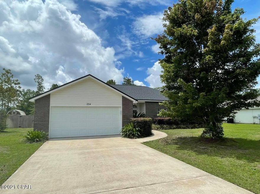 ACTIVE CONTINGENT -ACCEPTING BACKUP OFFERS! This move in ready home sits on 3/4's of a acre with NO homeowners association. This spacious 4 bedroom home offers a separate dining room and spacious living room.  The living room features a wood burning fireplace and high ceilings. The master bedroom offers lots of space and natural light with an en suite attached. The three other large bedrooms are on the opposite end of the home. The back patio is screen in and outlooks the large backyard.  There is a large metal building workshop that is in great condition (the awning only need to be repaired).   The roof was replaced in 2019 (with a transferrable warranty), The well pump is 275ft deep and was replaced in 2020 (comes with Culligan water softener system), septic is located in the front yard. (Last pumped 3 years ago). All utilities are located underground.