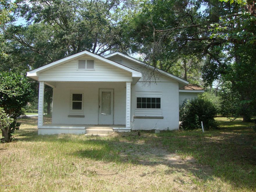 Fix and Save with this Older 3 Bedroom 1 Bath Block Home with over half an acre lot. Has eat in kitchen, living room and a laundry room. Home sits on a corner lot in a small rural town. Also has an old mobile home that does not have a title. Fix both them up. Live in one and rent the other out or have two rental units.  Check it out today.