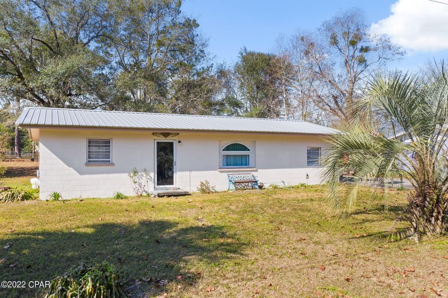 Rare find!  This FOUR bedroom home is located on a paved road in the city limits of Bonifay and is on a corner lot.  The galley style kitchen has stainless appliances and white shaker cabinets.  The exterior of this home is block and has a metal roof.  Home was recently updated and is ready for its new owner!