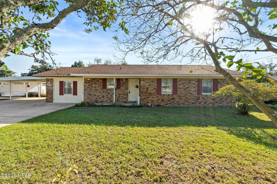 CURRENTLY UNDER CONTRACT, SELLER WILL CONSIDER BACKUP OFFERS

Charming 3-4 Bedroom Brick Home in the Heart of Lynn Haven

Welcome to this well-maintained 3 or 4 bedroom, 2 bath brick home with covered front porch located in the heart of Lynn Haven — just minutes from shopping, dining, medical facilities, and plenty of local fun!

Step inside to a spacious great room featuring a cozy wood-burning fireplace, plus an additional electric fireplace that comes with the home. The open kitchen overlooks the living area with a bar counter perfect for stools, making it ideal for entertaining. The kitchen and bathrooms feature durable tile flooring, and the master bath includes a convenient walk-in shower.

A large mudroom/laundry room provides easy access from the attached two-car carport, making it simple to unload groceries or stay dry on rainy days. The double driveway and oversized carport offer plenty of parking for guests.  The HVAC unit is approximately 5 years old and the roof was replaced in 2019.  

Enjoy outdoor living in the spacious backyard with an open patio — perfect for relaxing or grilling. A detached storage building provides extra space for tools, hobbies, or could even be transformed into your very own he shed/she shed. The property also includes a shallow well for working/gardening or playing outdoors.  

This golf cart-friendly neighborhood is just a short ride or walk to A.L. Kinsaul Park, a local favorite featuring a playground, splash pad, dog park, and beautiful bayfront views. The park also hosts city events throughout the year, including fireworks for the 4th of July and New Year's Eve.

Homes offering four bedrooms at this price point in such a fantastic location are rare — don't miss your chance to make this one yours!