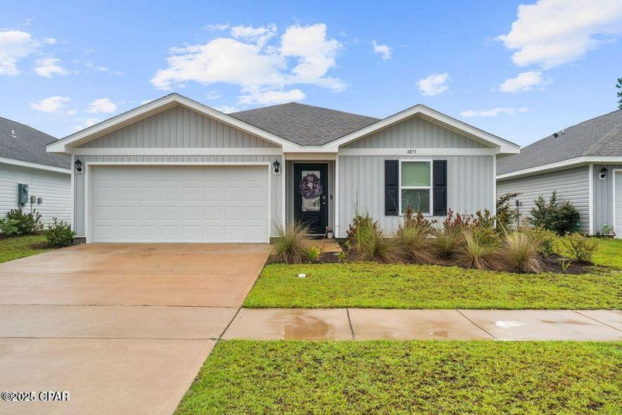 Welcome to this beautifully maintained 4 bedroom, 2 bath home located in the highly desirable Liberty community, just 14 miles from Tyndall Air Force Base. This property sits on a quiet homesite backing up to community-owned wooded land, offering rare privacy and natural views.

Inside, you'll enjoy a bright, open layout that's perfect for both everyday living and entertaining. The spacious kitchen features white shaker-style cabinets, a large center island, stainless steel Whirlpool appliances, and an easy flow into the living area—ideal for gatherings with family and friends.

The primary bedroom includes a generous walk-in closet, an en suite bathroom, and peaceful views of the greenery behind the home. The additional three bedrooms provide plenty of space for rest, work, or guests. A second full bathroom is conveniently located between two of the bedrooms for easy access.

Additional features include a dedicated laundry area, a two-car garage, and a large backyard ready to be customized into your own outdoor retreat.

Built just two years ago, this home offers modern construction, energy-efficient features, and low-maintenance living. The Liberty community provides exceptional amenities including two resort-style pools, a splash pad, two playgrounds, a fully equipped fitness center, pickleball courts, and a basketball court. You're also just minutes from the new Publix on Highway 231, and steps away from walking and biking paths throughout the neighborhood.

This home blends convenience, quality, and thoughtful design in one of Panama City's fastest-growing areas.