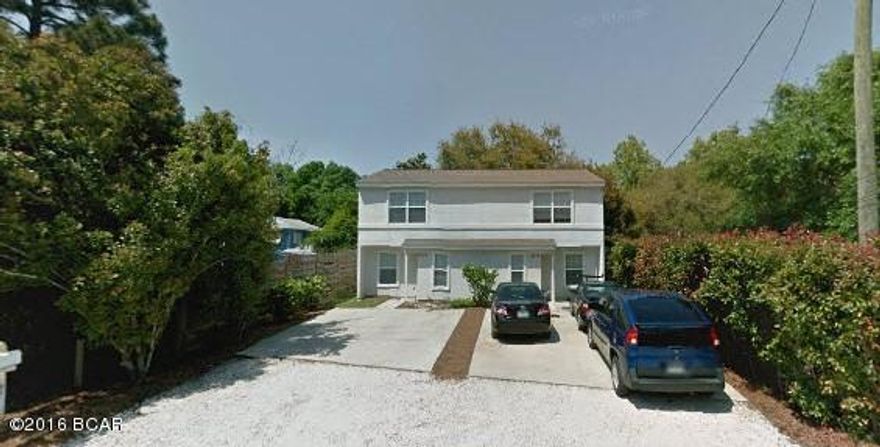 Investment opportunity potential 9% return! This well kept and maintained town home is just minutes from the Navy Base and located with 1/2 mile of water. Each unit is 1,024 sq. ft. and has laminate hard wood floors, full bath (with stand up shower) down stairs, 2 bedrooms upstairs, full bath and washer and dryer hookup. The kitchen features tile floors, wood cabinets. Has large back yard.