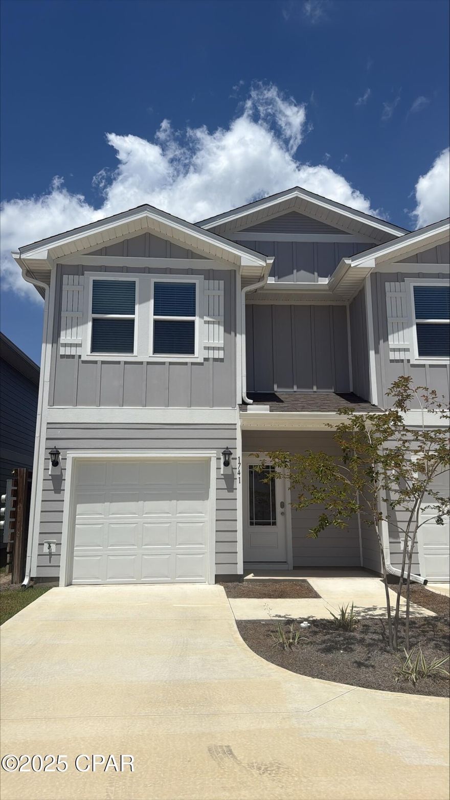 Welcome to Jake's Landing townhomes. This move in ready exterior unit is located at 1741 Jakes Drive. This townhome offers 3 bedrooms and 2.5 bathrooms and a single car garage. On the outside of these units, you will see quality Color-Plus Hardie Board exteriors, complemented by prairie-style doors and dimensional shingles with a 30-year warranty. Convenience meets security with steel garage doors equipped with openers, weatherproof outlets, hose bibs, and a fully sodded yard where cleared. As you enter inside, you will feel right at home with beautiful EVP flooring at your feet, leading you to the open living room and kitchen or the spacious upstairs. In the kitchen and bathroom, you will find gorgeous granite countertops, white cabinets with brushed nickel hardware, and a full stainless steel appliance package including a stove, microwave, dishwasher refrigerator, washer and dryer. Stay cool with energy-efficient cooling and heating systems, Low-E insulated windows with screens, and ceiling fans in the living room and primary bedroom as well as blinds installed throughout the home. Each home comes with modern Smart Home technology including a Skybell doorbell, Honeywell thermostat, and Smart Switches. An additional convenience is that landscaping and lawn maintenance is included. Rest assured with a one-year builder's warranty and a ten-year structural warranty through RWC. Located in the lovely city of Lynn Haven, Florida, you are not far from great food, shopping, schools, hospitals, and more. These homes offer easy access to Tyndall Air Force Base (just a 20-minute drive) and the world-famous white beaches of Panama City Beach (20 minutes away).