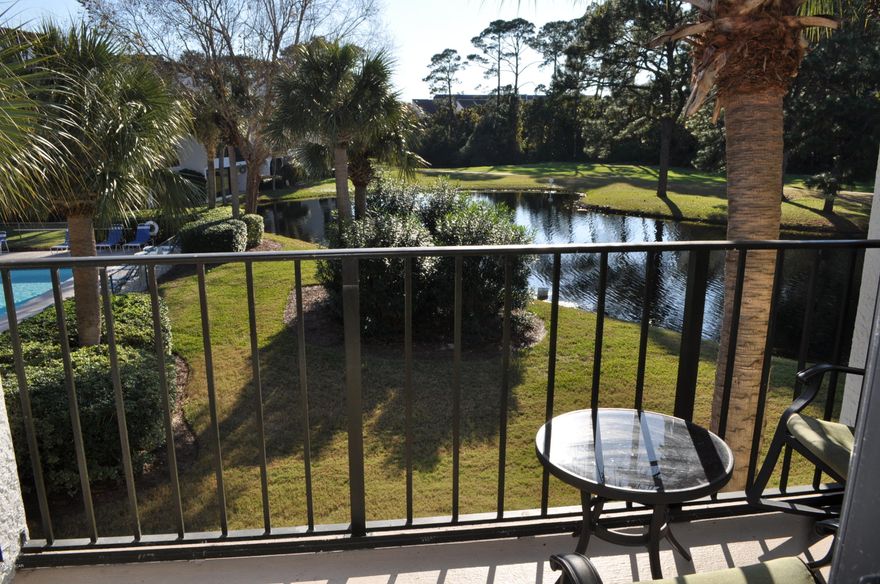 Practically brand new and finely appointed Edgewater Golf Villa overlooking a pool and a pond!  This 2BR/2BA unit has been completely updated in the last two years and the good news is...it's being sold furnished!  The sellers installed hand-sculpted wood floors, crown molding and custom draperies.  All new cabinets and stainless appliances added in the kitchen along with a custom tiled backsplash and granite counter tops.  Both bathrooms have new fixtures as well.  You won't need to do a thing but bring your golf clubs and bathing suit!  Edgewater is a gated community with 11 pools, 8 tennis courts, basketball courts, fitness center and jogging path, a par 3 9-hole golf course, and dedicated beach access.  All info is approx. and must be verified by Buyers if important.