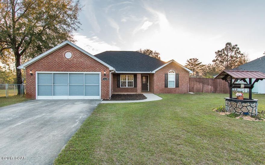 Stop what you're doing and schedule a time to come view this beautiful, like new home! This open floor plan consists of 3 bedrooms, 2 baths, AND it also comes with the vacant lot next door (total property is .55 acres)! This is an absolute amazing deal that won't last long. All the rooms are a nice size and both bathrooms are very spacious with plenty of counter top space. The large kitchen has an oversized island, tons of cabinets/counter tops, a pantry, and new lighting. Just a few of the other awesome updates are new flooring, fresh interior paint, beautiful lighting throughout, and a 17x8 screened-in florida room. Don't miss your opportunity to buy this incredible deal!