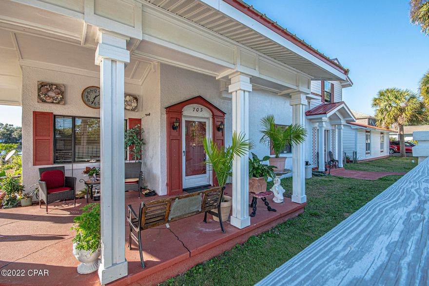 This extraordinary, one-of-a-kind, waterfront home evokes thoughts of a more genteel time. This beautifully maintained home boasts arched doorways and unique vintage touches such as the bow window with seating in the primary bedroom and custom built-ins. Relax and enjoy your unobstructed views of the Johnson Bayou and the Gulf of Mexico. Right in your backyard you will have an unlimited supply of fish and just a few hundred feet away you have direct access to the gulf. Expansive, covered, outdoor living makes entertaining a breeze. Your oversized sunroom allows you to enjoy sunsets all year round. Once you've put the final touches on this enchanting home, you could easily have a 4/3 w/ 2 living rooms and 2 foyers! We invite you to come and experience this home!

But wait, there's more! The home is within minutes of downtown Panama City! Two sides of the property are water-access and have a full reinforced sea-wall. Along with city water, there is a well. A beautiful, custom privacy fence encompasses the front of the property. There is an expansive three car garage with tiled floor and built in shelving. But wait, there's more! Use your imagination to utilize an adorable custom-built shed with a loft. In addition, the metal roof is three years old, the AC is one year old and the kitchen appliances are one year old. The master bathroom on the first floor and the second floor of the home (second living area, two bedrooms and a full bath) are in need of renovating as they roughed in.

Measurements to be verified by the buyer if necessary