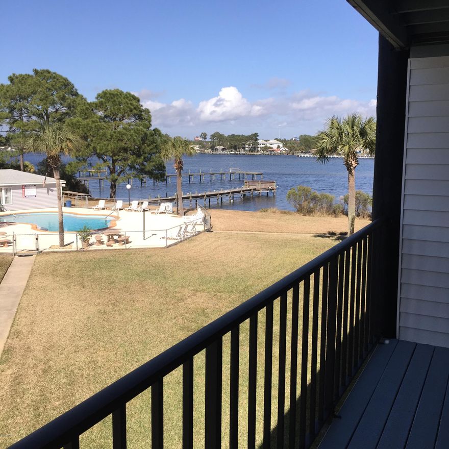 LOOK AT THIS PRICE and WELL UNDER $100,000! If you are ready to buy that condo, this is a must see unit! First, the location! This unit is well located in the waterfront community of Treasure Cove with a beautiful waterview from the balcony! Residents enjoy the fabulous waterfront location, fishing from the dock, boating, use of residence clubhouse, as well as the awesome community pool! This particular unit is well cared for with new floors, fresh paint, new appliances, and it is  beautifully and fully furnished! WOW! Notice the soothing view from the living room which opens to your generous balcony overlooking the pool and the boat dock! Even the master suite has a wonderful view of the lagoon! Not only is unit completely furnished, it comfortably sleeps 5 people! NICE! This smaller complex is also so close to fine dining, entertaining, and of course the beach!  Whether looking for a condo to live in, or retire in, this is a "must see" today!