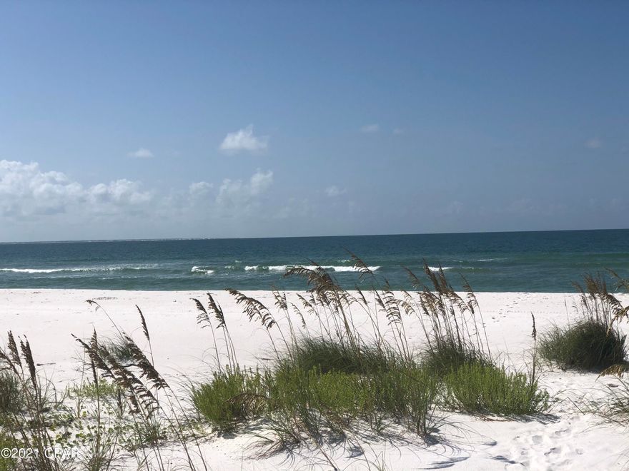 Sugar Sands is a beautiful upscale gated community on the Gulf just west of Mexico Beach and nestled next to Tyndall Air Force base.  Sugar Sands is a discreetly hidden gem along Highway 98, with white sandy beaches and beautiful waters.  It's a quieter, more family friendly and secluded beach experience than Panama City Beach, with a more relaxed vibe and lifestyle.  Build your dream vacation or primary home here, or create a high sought-after investment property. This oversized lot of 80' x 110' should give you plenty of space to sprawl out and enjoy the sun.  Sugar Sands is an Exclusive Super High End and High Tech, SMART Neighborhood that will have such features as 1 Gig internet and other cutting-edge technology throughout!  This lot offers the ability to build up, as 1st tier and interior lots can build at least one full story higher than the gulf front homes, therefore having unobstructed gulf/sunset views.  Amenities include: private gated access, gulf front community building with gym and resort style pool, palm lined streets, reflective gas lantern lighting, large 15' wide boardwalk with golf cart access to the beach, and the list goes on.  Minutes away from the beautiful town of Mexico Beach.  This is an extremely hard to find location and development in this beautiful area, one of a kind opportunity!