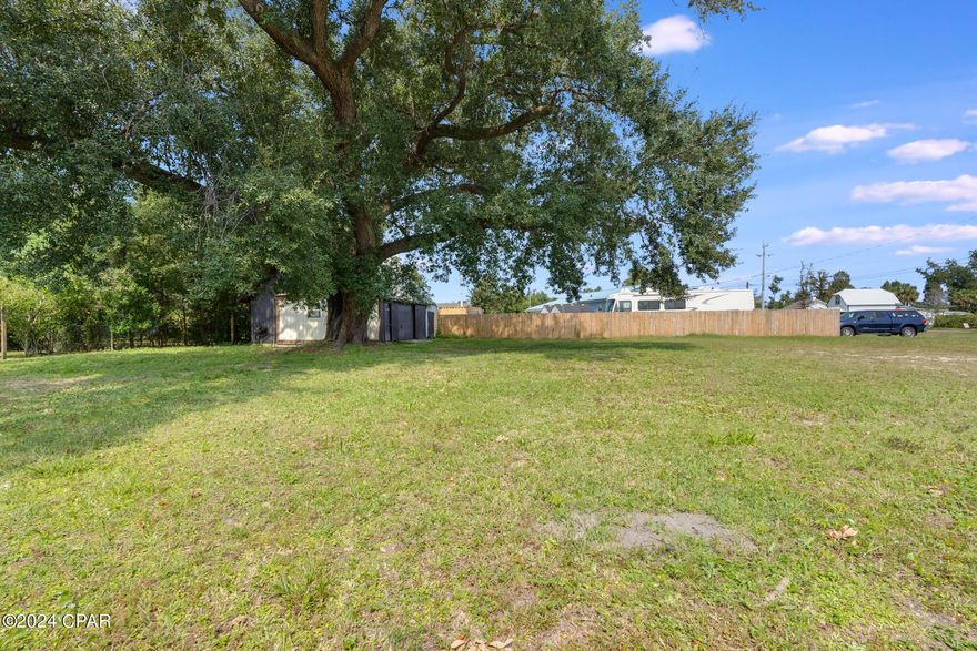 DESIRABLE LYNN HAVEN location is ready for your dream home! Enjoy the quiet neighborhood and charming streets that allow golf carts for an easy trip to City Hall , Parks, and Marina. This double lot features a    24 x 24 garage, paid impact fees and century old oaks . The original home was removed and leaves a clean slate for a large house, pool and landscaping. The 1990 built detached garage had hurricane damage but offers loads of possibilities for a large workshop or a separate apartment with its full height second story. NO HOA's, NO FLOOD INSURANCE REQUIRED.