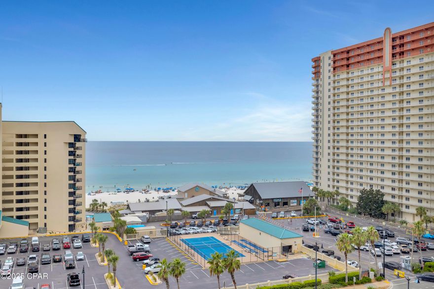 SEE THE SEA. ENJOY THE SPACE. EMBRACE THE RESORT LIFESTYLE.  
From the 9th floor of Laketown Wharf, this 3-bedroom, 3-bathroom condo with a bunk area delivers views, comfort, and convenience in one of Panama City Beach's most popular resorts. With 1,681 square feet, this tastefully decorated condo is being offered fully furnished, featuring LVP flooring throughout, king-sized beds in all three bedrooms, stainless steel appliances, flat screen TVs, and a washer and dryer. The spacious balcony sets the stage for unforgettable sunsets over the Gulf.  Laketown Wharf is known for its unmatched amenities. Residents and guests enjoy five pools, including one heated year-round, two hot tubs, a fitness center overlooking the Gulf, a kids' playground, pickleball, and even mini golf. The 52,000 square-foot boardwalk circles the lake with a nightly fountain and light show. Direct, gated beach access sits right next door to Pineapple Willy's.  On the ground level, you'll find a lineup of restaurants, shops, and entertainment: Juan Taco, Wharf Seafood Buffet, The Candymaker Ice Cream Shop, PCB Pizza, In Cahoots for breakfast and brunch, The Press coffee shop, The Bun Lab, and more. The property also offers 810 Billiards & Bowling, a salon and nail bar, barbecue and pet areas, a poolside Splash Bar & Grill, two parking garages, and beach chair rentals. HOA dues include water, sewer, trash, cable/TV, pest control, WiFi, and full use of amenities.  Nearby attractions continue to grow, with Dolly Parton's Pirate Theater and Topgolf now open in Panama City Beach. Whether you're looking for a vacation home, income-producing rental, or a place to enjoy the coastal lifestyle full-time, Laketown Wharf 921 is an opportunity worth seeing.  All information is deemed reliable but should be verified by the buyer if important.