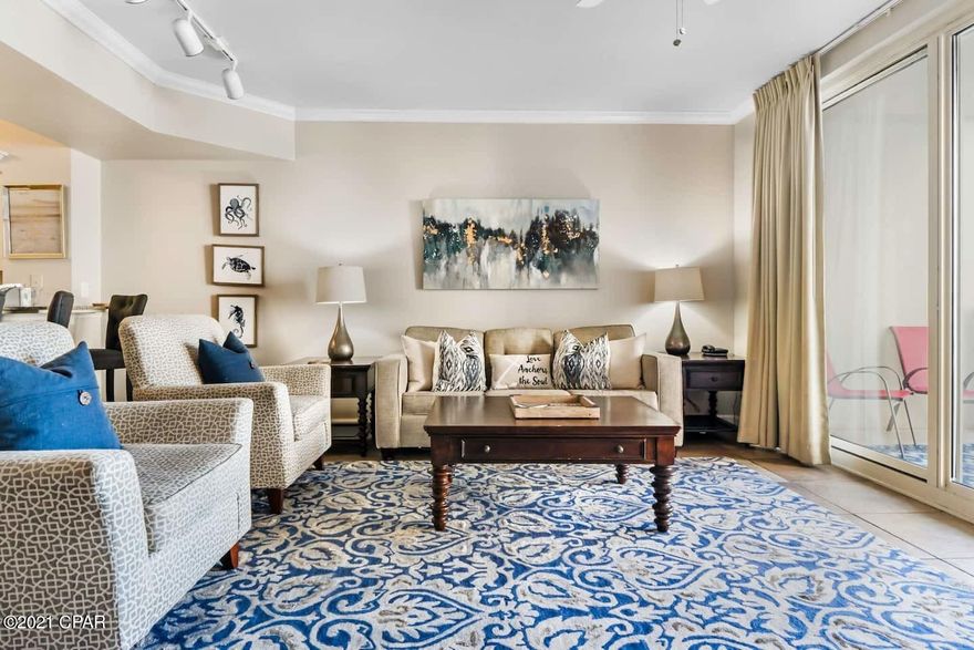 Take in peaceful, elevated water views in this stunning Shores of Panama Condo. Offering a living room and master bedroom with direct pool and Gulf views and a private bunkroom. Additionally, two full baths make for wonderful ease of living. Enjoy welcoming, beautifully furnished spaces with new flooring, upgraded lighting, and vibrant color scheme. Relax by the pool or in the inviting living room or sip a cool drink out on the spacious oversized balcony and gaze at the pool and Gulf beyond. Amazing open ''C'' floor plan with a rare layout. Turnkey and ready to rent. Convenient same floor floor deeded parking space included with the unit. Fantastic investment opportunity. Shores of Panama, is a 23 story Tuscany style condominium of gulf front luxury accommodations offering unparalleled amenities including almost 500' of Gulf frontage, 13,966 sq. ft. million dollar Gulfside, zero entry lagoon-style gulf side pool, Gulf side hot tub, Large heated indoor pool & hot tub, Covered on-site parking deck, Health center with fitness equipment, Two tiki bars serving lunch and dinner, Beach activities and rental services, Free high-speed internet access,  and more, surrounded by beautiful exterior details. The Shores of Panama is an excellent location on the beach next to Pineapple Willy's and is within walking distance of other restaurants and entertainment. Like thousands of visitors each year, your family will LOVE Shores of Panama.