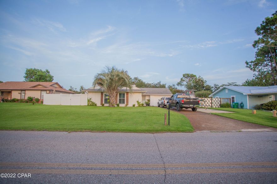 Amazing home just a few minutes from the Navy Base!  This home has many great features including an updated kitchen, with granite counter tops, subway tile backsplash custom cabinets, and both master and guest bathrooms.  There is wood grain tile throughout and brand new carpet in the bedrooms; each of the bedrooms' windows have beautiful plantation shutters, as well.  There is a large utility with shelving and drawers already installed.  The metal roof was just put on about a year ago.   The home offers a huge front and back yard which has a Rain Bird sprinkler system in front and back to get the grass to green up beautifully during the warm months.  There is a beautiful white vinyl fence that surrounds the whole back yard for privacy.  In the backyard you'll find a spacious screened-in b back patio and a gazebo to enjoy the beautiful Florida weather.  There are two spacious sheds in the backyard too.  One has been used for storage and the other has been insulated and drywalled, power ran to it and been used as an office and sleeping quarters for guests; perhaps, even used as an AirBNB.  Home comes with faux shutters and gutter system.  All of these features and more!  Come see this home before it's gone!