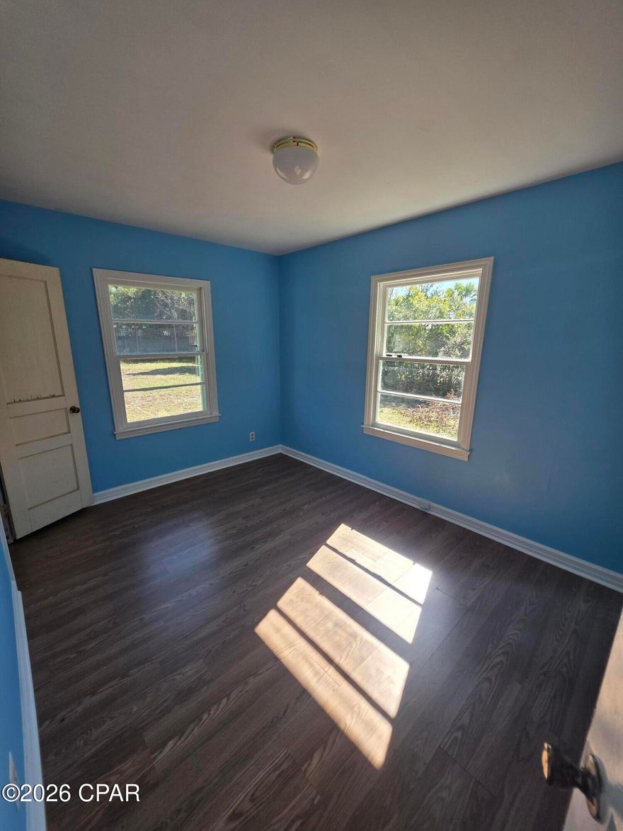 Opportunity property with value-add potential in Panama City. This 3-bedroom, 1-bath home offers 900 square feet on an oversized 0.309-acre lot inside city limits. The roof was replaced in 2019, providing a key structural update already completed.

The single-story layout includes vinyl plank flooring, a functional living and dining area, built-in bedroom storage, and a dedicated laundry space. A screened front porch adds covered outdoor space, while the detached one-car garage is connected by a covered breezeway for convenient access.

The fenced backyard offers, generous depth, and room for future improvements or expansion. With no HOA restrictions and a large lot size, the property provides flexibility for renovation and long-term upside.

Located near Downtown Panama City and St. Andrews Bay, this home offers convenient access to shopping, dining, parks, and waterfront amenities within Bay County. A strong opportunity in an established residential setting.

Conveniently located near everyday amenities, the property is approximately 1.2 miles from Downtown Panama City and about 1.1 miles from St. Andrews Bay access. Grocery options including Publix Super Market at Millville are approximately 0.8 miles away, with additional shopping and dining along 15th Street within roughly 1 to 1.5 miles. Oakland Terrace Park is approximately 0.6 miles away for outdoor recreation. Nearby schools include Cherry Street Elementary approximately 0.9 miles away, Rosenwald High School approximately 0.7 miles away, Jinks Middle School approximately 1.3 miles away, and Bay High School approximately 1.5 miles away.