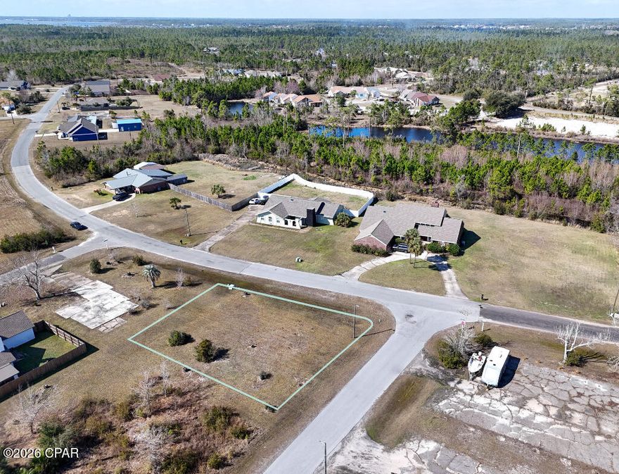 Incredible buildable corner lot in Sandy Creek Ranch. This cleared .22 acre homesite is in a private community with all underground utilities available. Whether you're dreaming of crafting your ideal home, creating a peaceful retreat, or developing an investment property, this prime location offers great potential. The lot behind it is also available to expand your needs. Quick access to Tyndall Air Force Base and a breezy drive to shopping, restaurants, marina, and Panama City Beach. Great area with lots of lakes, ponds, and waterways connecting to the Gulf of Mexico. Ideal for those seeking relaxation and convenience.