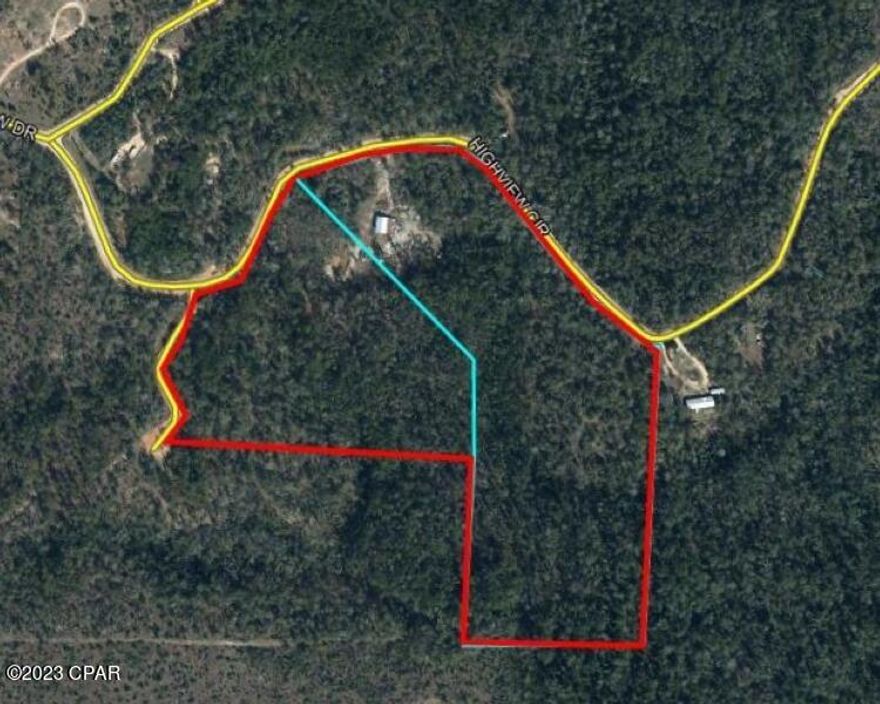 Survivalist Dream !!!  Over 28 acres of your own land with Water Source, Fertile Ground, Deer, Turkey, Rabbit, Dove, Cabin and Pole Barn. Everything you need for off grid or on grid living. There is an active  200 amp Electrical Service that has been brought in to the living areas.    Many extras come with this property such as Brick to build your smokehouse, Pipe to run your plumbing, Barrels to store your water and food, and many other materials to privatize your home. Located in one of Northwest Florida's most pristine areas. Most of this 28 acres has been left to its original Florida Landscape with 3 acres cut out for the Pole barn and Cabin. The property has beautiful hardwoods along with Cedar, Cypress and Dogwoods as far as you can see. A never ending artesian stream keeps the two ponds full of fresh water and the wildlife constantly comes for a drink each evening. On this property there are rafters of turkeys who come in to feast on the wild blackberries , rabbits that love to chase each other around the pond and deer who consistently come to show off their young. Seller has planted Pear, Apple, Citrus  and Banana trees on the property.  Paths have been made in special areas for access around the property. If your goal is to own a private oasis that will keep you safe and fed, then this is the property for you. The peace you will receive sitting under your 30 x 48 pole barn and living in your 12 x16  cabin will bring you back to the way life was always meant to be lived, with the simple things.
