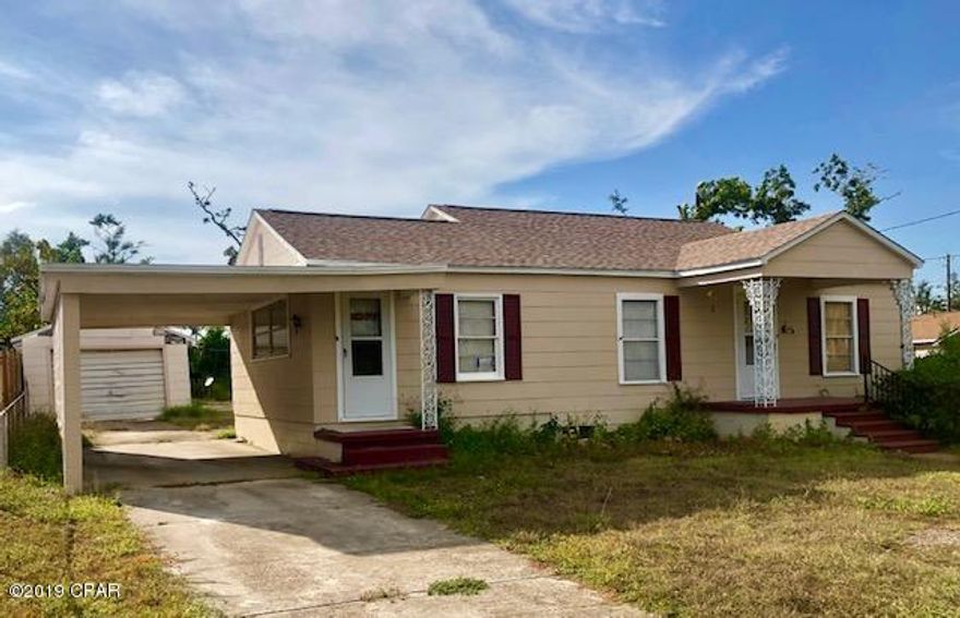 Investor/flipper dream!  Classic, 3/1 charming Millville home on over-sized lot.  Has new roof but needs interior update/renovation. Close to downtown and Tyndall.  Priced to sell quickly  ''as-is'' to investor or other cash buyer.  Two detached outbuildings sustained hurricane damage which needs to be address by buyer.  Two separate adjacent building lots also available for purchase (see separate MLS listings)