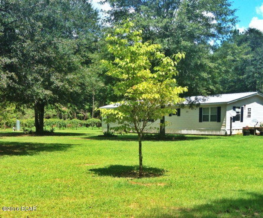 This 3/2 home is north of Cottondale and less than 30 miles to Dothan, Alabama. Shopping is not a problem as the property is close to Graceville and Panama City as well. Minutes from restaurants, theater, shopping, Florida Caverns, parks, Chipola College, Federal Correctional Institution, natural springs. Enjoy kayaking, tubing and canoeing on the famous Chipola river and so much more in beautiful Marianna Florida! It's nice to have a choice of enjoying either staying at home in this very private, quiet setting or run to town and enjoy an evening or day out. This home has a huge kitchen with lots of storage, desk area and an island, open floor plan and all three bedrooms are large with walk in closets. It has a new roof and an alarm system installed. They have monthly pest control to keep out those pesky bugs!The yard has satsuma, azaleas, knockout roses and a scuppernong vine that is loaded and ready for picking, a fish cleaning station and three outdoor water spickets. No problem with storage outside with an 18x30 shed w/carport. A definite asset is the large screened in porch that overlooks a a large yard and woods that offer an epitome of wild life that includes raccoons, fox, hummingbirds, birds that nest yearly, deer, fireflies and a family favorite, an owl. Sit under the vivid stars and listen to nature! The home is located only one mile down a dirt road right off Hwy 231. There are no visible neighbors from the property, however the ones near are quiet and friendly.