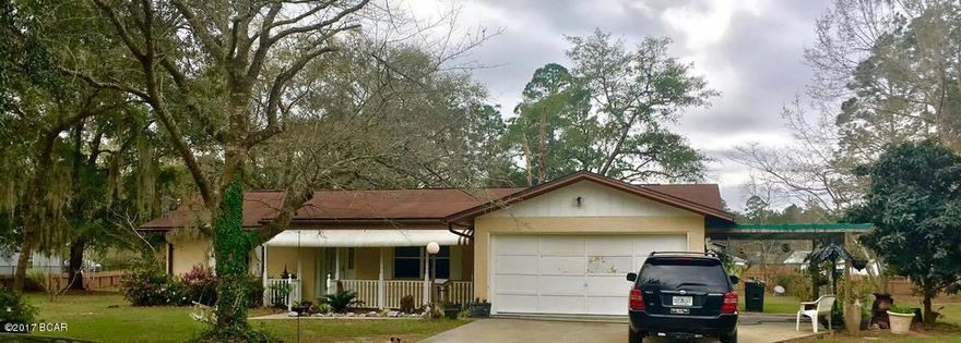 WATERFRONT home nestled on a lake stocked with large bass. Fish right off the dock in the back yard. Cute Florida Cottage that has been very well kept. The owner's enclosed the back porch to create a 4th bedroom. The roof and AC was installed in 2000, and a new water heater in 2007. The home is concrete block with stucco, which has just been painted with Rhino Shield coating, under a 25 year warranty! Huge 12x20 workshop in the back for the tools and lawn mower. Very beautifully landscaped and cleared lot on nearly an acre of fenced property. Bring all offers she's ready to move!