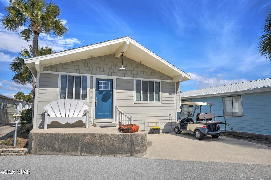 Welcome to your perfect beach getaway in the highly sought-after Venture Out Resort in Panama City Beach! This beautifully maintained 3 bedroom, 2 bath home is being sold fully furnished and includes a golf cart, making it completely turnkey and ready for immediate enjoyment or rental income.

Step inside to a bright and inviting open floor plan featuring durable vinyl plank flooring throughout the main living areas and a light, coastal color palette that creates a relaxed beachy vibe. The spacious living room flows seamlessly into the kitchen, offering plenty of room for family and guests to gather.

The kitchen is well-equipped with ample cabinetry, generous counter space, and everything needed for everyday living or vacation stays. Just off the main living area, you'll find comfortable bedrooms, including a flexible third bedroom that can easily serve as a bunk room or additional guest space.

Enjoy your morning coffee or unwind after a day at the beach in this cozy and welcoming home designed for easy coastal living.

Located in a gated, golf cart-friendly community, Venture Out offers incredible amenities including private beach access, two swimming pools, fishing pier, boat ramp, playground, and 24/7 security. Whether you're looking for a second home, investment property, or full-time residence, this one checks all the boxes.

Don't miss this opportunity to own a turnkey beach home in one of PCB's most popular resort communities!