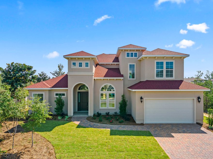 CURRENTLY UNDER CONTRACT, SELLER ACCEPTING BACKUP OFFERS.  Stunning brand new home in the beautiful, upscale, gated community of Preserve on the Bay, in the heart of Panama City Beach. This one of a kind home features 2,955 sq. ft. of luxury living with an inviting open floor plan, which comprises 4 bedrooms and 3 1/2 baths.  As you enter the home you are immediately greeted with quality and class, a 20'+ high entry ceiling, beautiful hardwood floors, a large living area with extensive use of windows overlooking the professionally landscaped back yard and natural preserve area. The formal dining room with a 14' high tray ceiling, wood flooring throughout the main areas and Master Bedroom, extensive use of trim, granite counter tops, 10' ceilings, and 8' doors throughout are just some of the other exquisite features of this home. For the cooking enthusiast, the large open plan Kitchen features stainless steel appliances(which includes a natural gas cooktop, wall oven, french door refrigerator), a walk-in pantry, an oversized island incorporating a breakfast bar, and a large window overlooking the back garden allowing plenty of natural light to filter into the kitchen. 

The Master Suite wing features an oversized bedroom, double large walk-in closets, double vanity sink, a free standing soaking garden tub, and a beautiful separate tiled glass enclosed shower. All bedrooms in this home are en-suite and each bedroom features its own large closet.  This is a highly energy efficient and well constructed home utilizing 2"x6" framing which allows for enhanced insulation values, as well as double paned low-E windows. The home is backed by a comprehensive Builders Warranty. All dimensions are approximate, please measure and verify for accuracy.