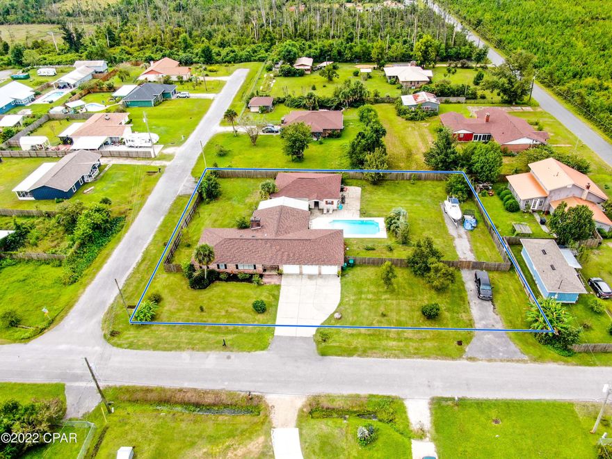 CURRENTLY UNDER CONTRACT, SELLER WILL CONSIDER BACKUP OFFERS  Talk about room to spread out! This spacious lot allows for all your water or land toys and BBQ gatherings with plenty of elbow room! Entertaining gets even better when you can all enjoy the large inground pool. The home features a massive living area to gather, Large kitchen, 3 full bedrooms and a 4th room that is being used as a bedroom but can be an office, playroom or second living space, formal dining area and no worry about parking with the 4 yes FOUR garages and long driveway. Hurry don't wait to see this home. All measurements are not exact and need to be verified if important.
