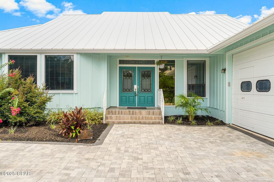 This inviting 3-bedroom, 2 ½-bathroom canal front home offers a blend of comfort and convenience, with direct access to the Gulf for boating enthusiasts! The interior features vaulted ceilings with exposed beams, providing a spacious atmosphere throughout the living area.
Step outside to a wrap-around deck and a screened-in lanai, perfect for enjoying the coastal breeze and outdoor relaxation! The master bedroom offers pleasing water views and a private en-suite bathroom, complete with a separate walk-in shower and a jetted bathtub.
Additional amenities include a two-car garage and new insulation throughout the home for improved energy efficiency. The property features 80 feet of water frontage and a 1500-pound boat lift, allowing for easy boat access and the possibility of spotting dolphins while enjoying the waterfront.
Situated within a gated community that provides 24-hour security, this home ensures a safe and tranquil living environment. 

Schedule a showing to explore the features of this canal front property in a wonderful neighborhood!!
