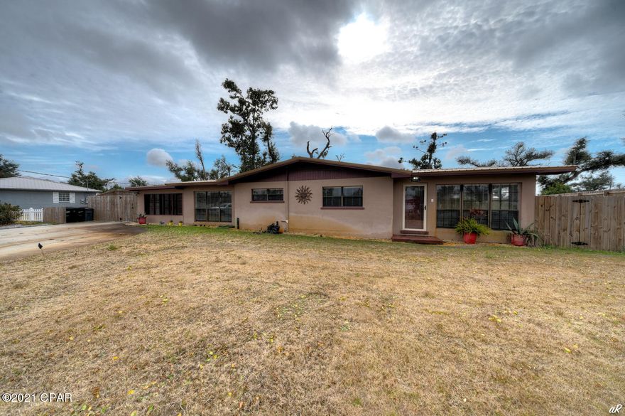 CURRENTLY UNDER CONTRACT, SELLER ACCEPTING BACKUP OFFERS - Beautifully remodeled home with very open, spacious floor plan!  The main home has 3 bedrooms with a bonus room, lots of space to spread out in!  New LVP flooring installed throughout makes for easy clean up and floor maintenance.  This lovely home has an inground pool with a waterfall feature!  There is also a pool house on the property that has a full bathroom, partial kitchen and open room that could be yet another bedroom for that person you live with, but you need some space from!  There is a large shed on the property that will convey and the back yard is privacy fenced all the way around.  This home has lots of parking available and a large, screened in porch with an enclosed storage area. Schedule your viewing appointment to see this wonderful home today!!  Conveniently located to Tyndall Air Force Base, Grocery Stores and many Restaurants.  Only about 20 minutes to Panama City Beach or Mexico Beach.  Don't miss out on this one!!  Buyer to verify all sizes and measurements if important.