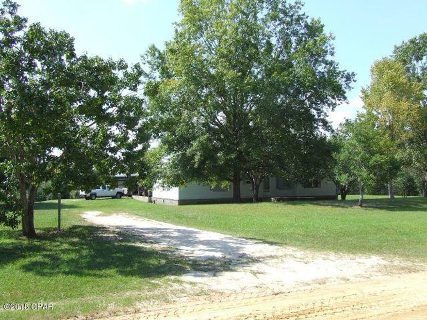CURRENTLY UNDER CONTRACT. SELLER IS ACCEPTING BACK-UP OFFERS.  Horse Lovers or Hobby Farm?  Here it is, just outside the City Limits of Bonifay.... A 1995 3 bedroom 2 bath manufactured home with 1848 square feet heated & cooled living space sits just behind the shady oaks in the front yard.  Very large covered patio and garage (32x56) with concrete floor -- PLENTY of room for cookouts & entertaining. Fenced and cross-fenced acreage with a huge 52x70 enclosed barn for those horses, cattle, or both!  You have always wanted your own little farm....HERE IT IS!!!!