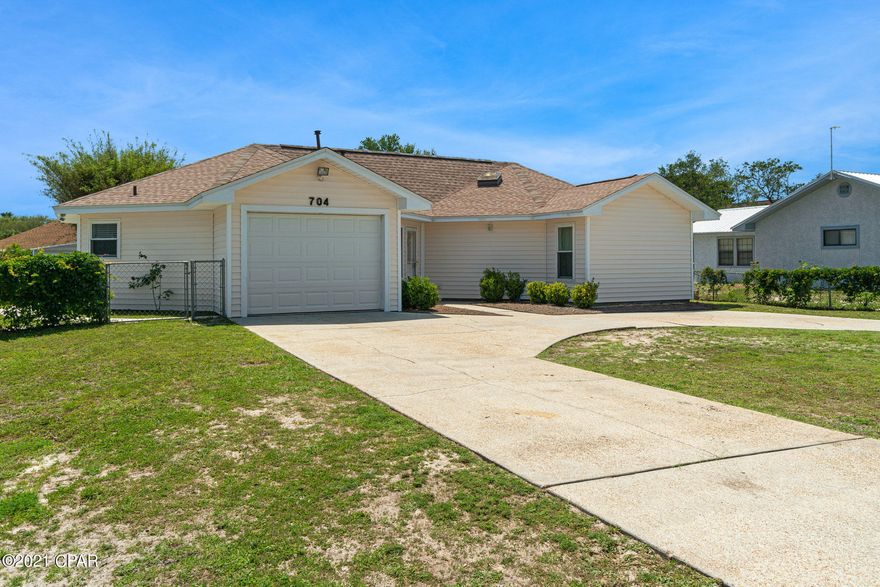 This home has been completely updated top to bottom over the last few years. New roof, A/C, water heater , etc. The interior features open floorplan in main living areas with travertine floors in all main areas. All 3 bedrooms feature luxurious wood floors. Master bedroom has plenty room for a seating area or a work station and double closets. There is a big custom walk-in shower with glass shower doors in the hallway bathroom. The sliding glass door in the living room overlooks the back covered porch and the fenced back yard with a yard building. The lot is huge and parking for lots of vehicles as this home has a circular driveway with a 1 car garage. All information is believed to be correct but should be verified by the Buyer.