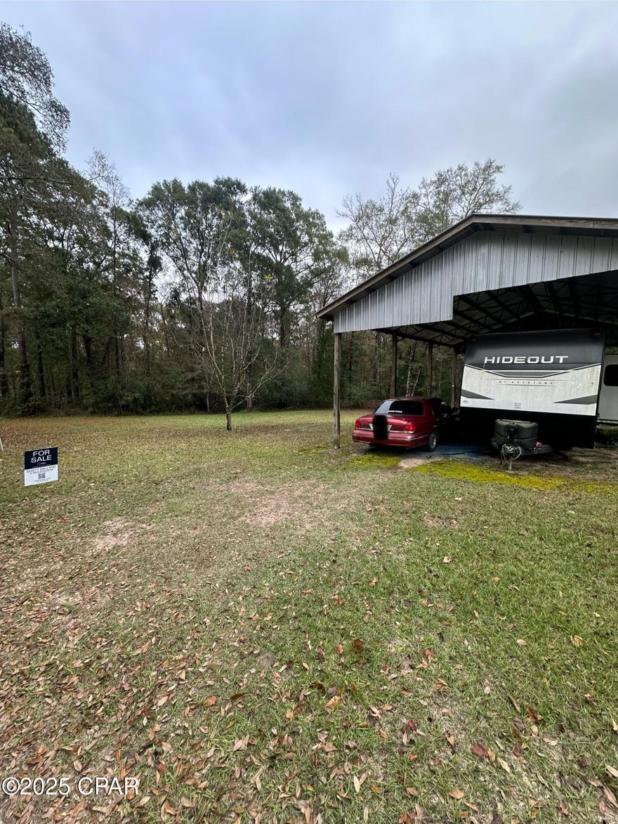 Discover the perfect river getaway on this 0.35-acre lot just off the Choctawhatchee River. This property is fully equipped and ready for immediate enjoyment, featuring a 24x36 pole barn, active power, septic, and well already in place. Included with the property is a 2022 Keystone Hideout 32LBH, offering one of the most desirable family-friendly floorplans on the market.



The Keystone Hideout 32LBH features a rear private bunkhouse, private front master bedroom, spacious living area with large slide, U-shaped dinette, sleeps up to 10, and full kitchen and bath amenities. At over 36 feet long with generous tank capacities and modern conveniences throughout, it offers exceptional comfort for weekend getaways or extended stays.



Whether you're looking for a vacation retreat, weekend escape, or a place to enjoy river life, this property is turn-key and ready to go.