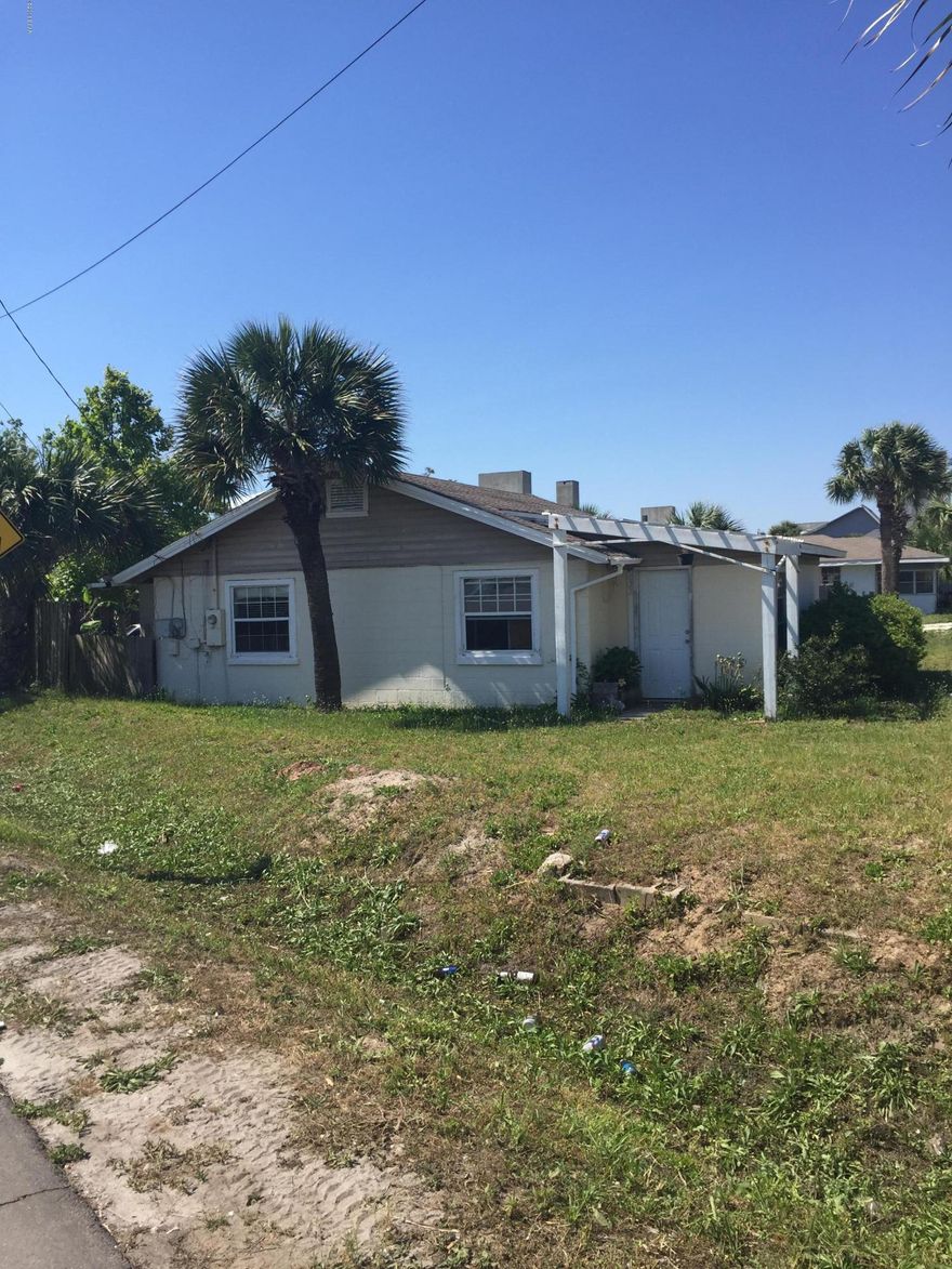 THIS UNIQUE CEMENT BLOCK HOME IS A MUST SEE. SITTING ON A HUGE DOUBLE LOT, JUST STEPS FROM THE BEAUTIFUL GULF OF MEXICO, WALKNG DISTANCE TO MANY OF THE AREA'S LOCAL ATTRACTIONS, RESTAURANTS AND THE COUNTY PIER JUST TO NAME A FEW. THIS IS AN IDEAL FIXER UPPER FOR THE HANDY MAN LOOKING FOR A PROJECT OR THE PERFECT PARCEL FOR A BUILDER LOOKING TO MONOPOLIZE ON A PRIME PIECE OF REAL ESTATE WITH GORGEOUS GULF VIEWS. YOUR OPTIONS ARE ENDLESS. DON'T LET THIS ONE GET AWAY!