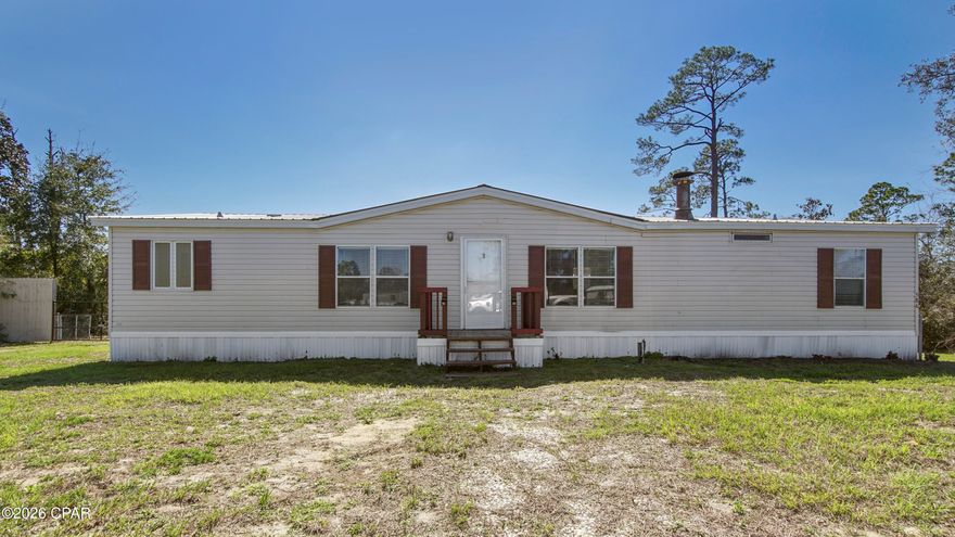 Affordable waterfront living! This large 3Br/2Ba manufactured home features fresh paint, large rooms, fireplace, sits on 0.69 acres, metal roof, and a huge back porch. Relax and watch the sunset from this expansive porch or on dock. Plenty of fish to catch here too! Bring your boat or jet ski to head out to North Bay. If you prefer, you can lazily Kayak around to enjoy the nature among the needle rush. Hickory Bluff is only minutes from shopping, dining, and the beautiful white sands of Panama City Beach!