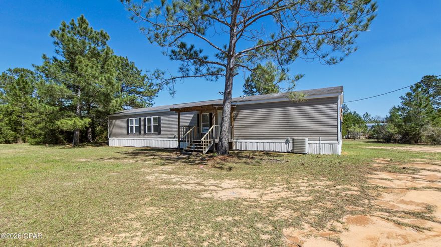 Move-in ready 3-bedroom, 2-bath home situated on a spacious 0.50-acre lot in Cottondale's Parrot Bay subdivision. This 2015 home offers 1,216 sq ft of comfortable living space with brand-new flooring throughout, new kitchen appliances, and new exterior skirting for added curb appeal and durability. The large lot provides plenty of room for outdoor living, storage, or future improvements. Perfect for first-time buyers or investors seeking an affordable property with recent updates. Utilize the outdoor storage building. Ask about available lender credits and zero-down payment assistance programs for qualified buyers, making homeownership more accessible than ever. Schedule your showing today!